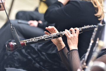 English horn in the hands of a musician, during a classical music concert