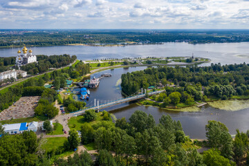 Fototapeta na wymiar Aerial view of Volga and Kotorosl rivers confluence, Damansky bridge and Strelka park on sunny summer day. Yaroslavl, Yaroslavl Oblast, Russia..