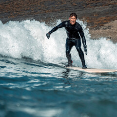 Man surfing a wave in Devon