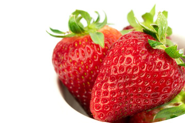 close up take of fresh strawberries with white background