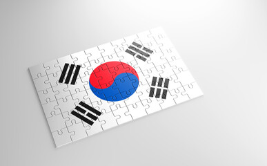 Fototapeta premium A jigsaw puzzle with a print of the flag of South Korea, pieces of the puzzle isolated on white background. Fulfillment and perfection concept. Symbol of national integrity. 3D illustration.