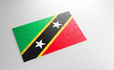 A jigsaw puzzle with a print of the flag of Saint Kitts and Nevis, pieces of the puzzle isolated on white background. Fulfillment and perfection concept. Symbol of national integrity. 3D illustration.