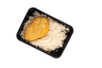 Lunch box with boiled rice and chicken cutlet. Food delivery. Top view. Isolated.