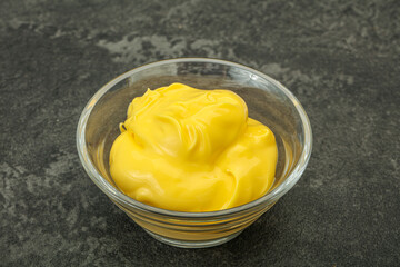 Natural cheese sauce in the bowl
