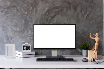 Mock up : Stylish or designer workspace with desktop computer, creative supplies, houseplant and vintage books on white work table at home or studio. Blank screen for graphics display montage