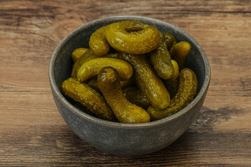 Pickled gherkin in the bowl