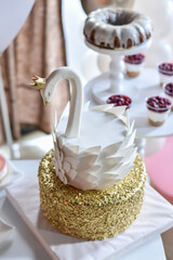  A swan-shaped cake on a golden cloud