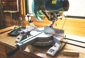 Electric Mitre saw used for woodwork cutting process.