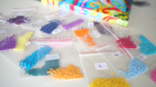 Beads. Colorful beads. Colorful rhinestones.Needlework.Hobby.Diamond embroidery. Diamond paintings.