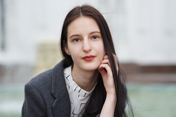 Portrait of a young beautiful girl in the park