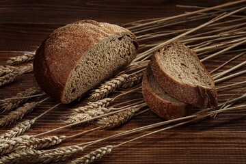 Sliced rye bread on a wooden background