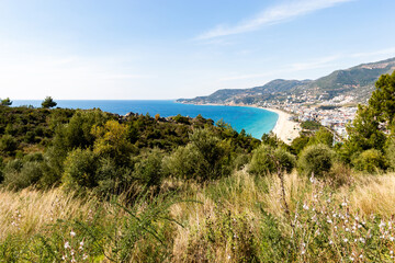 Mediterranean coastline. Blue sea, hills and clear sky.