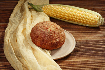 Corn bun on a wooden background