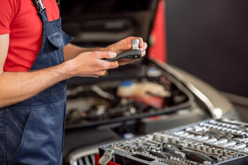 Auto mechanic hands with detail over open drawer