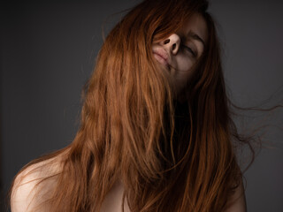 Naklejka premium Portrait of beautiful woman on gray background bare shoulders close-up cropped view