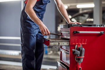 Male hands with working tool in workshop