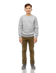 childhood, fashion and people concept - portrait of happy smiling boy over grey background