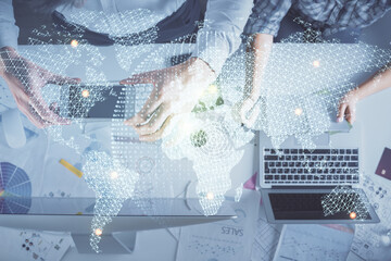 Double exposure of man and woman working together and business theme hologram drawing. Computer background. Top View.