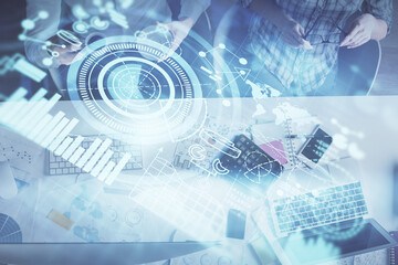 Double exposure of man and woman working together and business theme hologram drawing. Computer background. Top View.