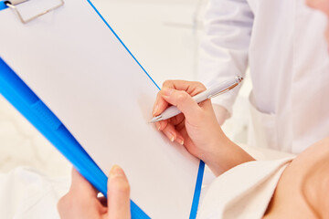 Patient signing a contract