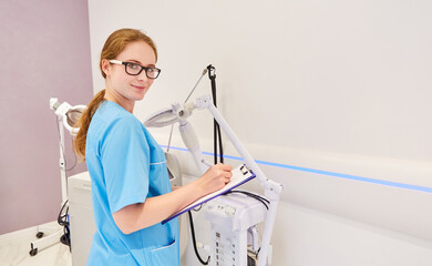 Surgical nurse with checklist for an operation