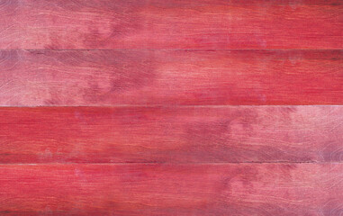 Red wooden surface background texture, with copy space for your text and design. Top view.