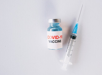 Covid-19 coronavirus vaccine and syringe