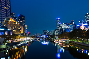 Melbourne, Australia - April 8, 2021: Yarra river and city buildings in evening