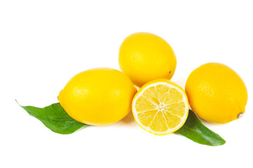Pile of ripe lemons with green leaves isolated on a white background