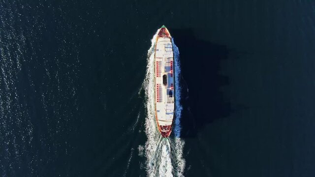Stunning high angle aerial drone bird's eye 4k footage of a Freshwater class ferry connecting Circular Quay in Sydney CBD with the famous beachside suburb of Manly on Sydney's Northern Beaches.