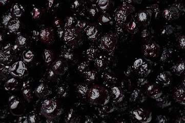 Bilberry on white plate isolated on white background. Top view. Free space for your text.