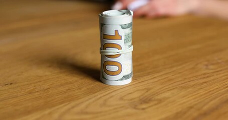 Female Hands take a roll of dollars, dealer exchange, selling illegal drugs for money