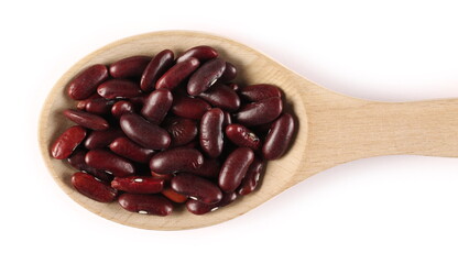 Raw red kidney beans in wooden spoon isolated on white background, top view