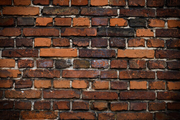 Brick wall red old weathered texture background. Grunge old house aged dark bricks.
