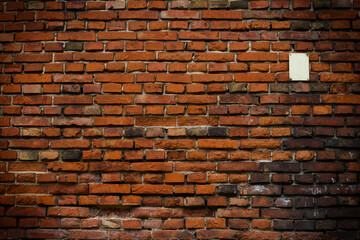 Brick wall red old weathered texture background. Grunge old house aged dark bricks.