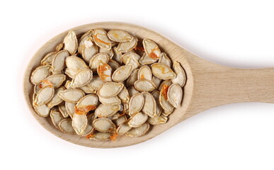 Dry muscat squash seeds in wooden spoon isolated on white background, top view