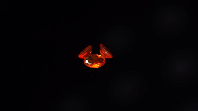 natural yellow fire opal gemstone on the turning table