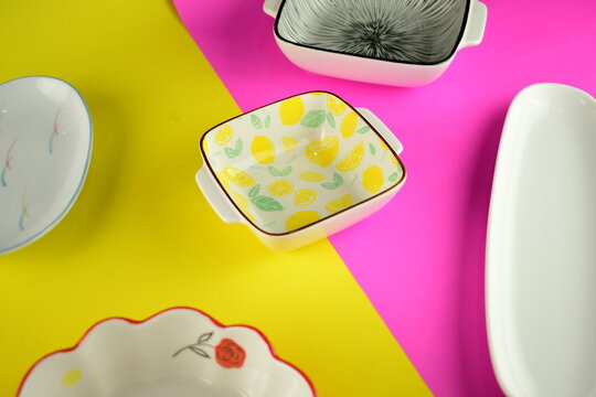 yellow lemon pattern ceramic bowl with othe cute on beautiful beight pink and yellow background
