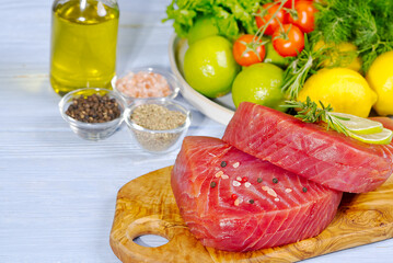 Tuna raw Steak, tuna sashimi, tuna fish sliced with vegetables. Healthy eating with seafood, we cook at home. Cooking receipt concept, fish menu
