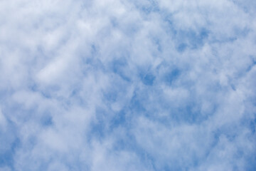 Fototapeta premium Soft white clouds texture on beautiful afternoon sky background. Image for background design The clear sky makes you feel fresh and clear.