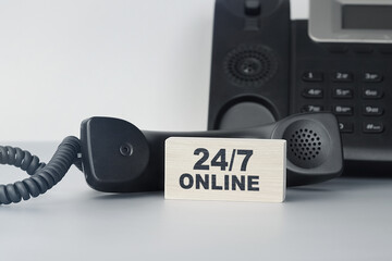 Closeup of the wooden block with text - 24/7 Twenty four seven online