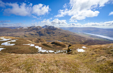 The mountain summits of Ben Lawers, Meall Corranaich with Lochan na Lairige below from Meall nan...