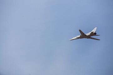 four jet planes are flying in a tight formation. dangerous aerobatics are shown at the aviation festival by pilots. military parade of modern fighter planes