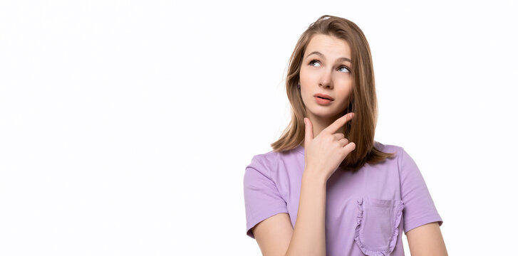 young pretty woman looking thinking with hand on chin, wondering or asking a question. Place for your text