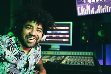 African music engineer working inside production studio - Focus on man face