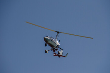 Fototapeta na wymiar small helicopter on blue sky