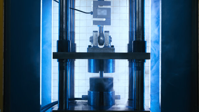 Industrial pressing machine testing rubber material