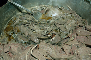 Bread with spleen called pane ca meusa is a tyical street food of Palermo city in Sicily
