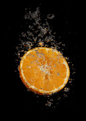 Orange splashing in water