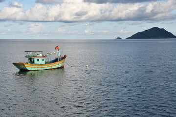 Vietnamese Fishing Boat, Island, and Sea Horizon